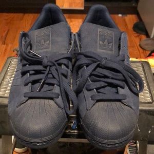 Navy suede shell toe adidas sneakers